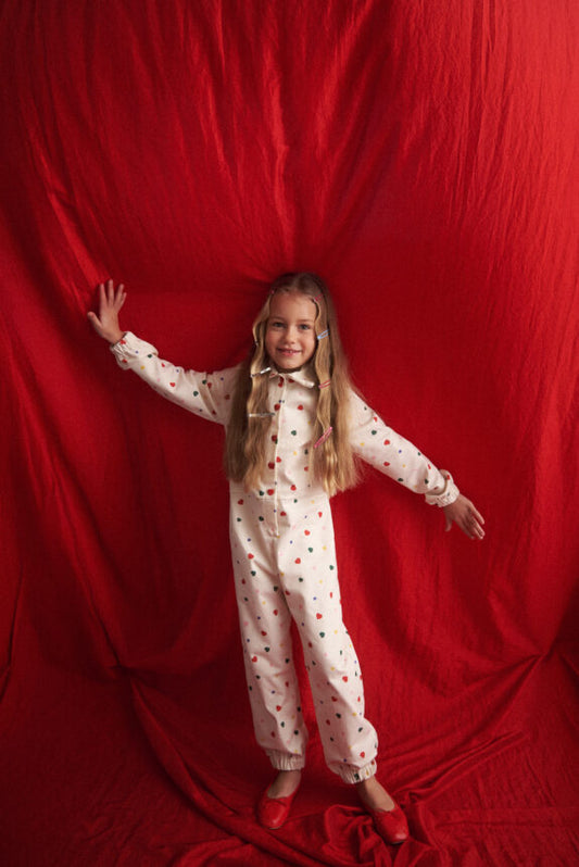 TWO IN A CASTLE HEARTS ALLOVER JUMPSUIT